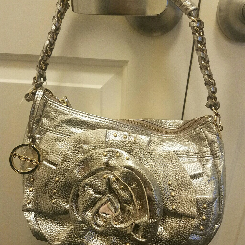 Gorgeous Bebe Rose gold leather purse